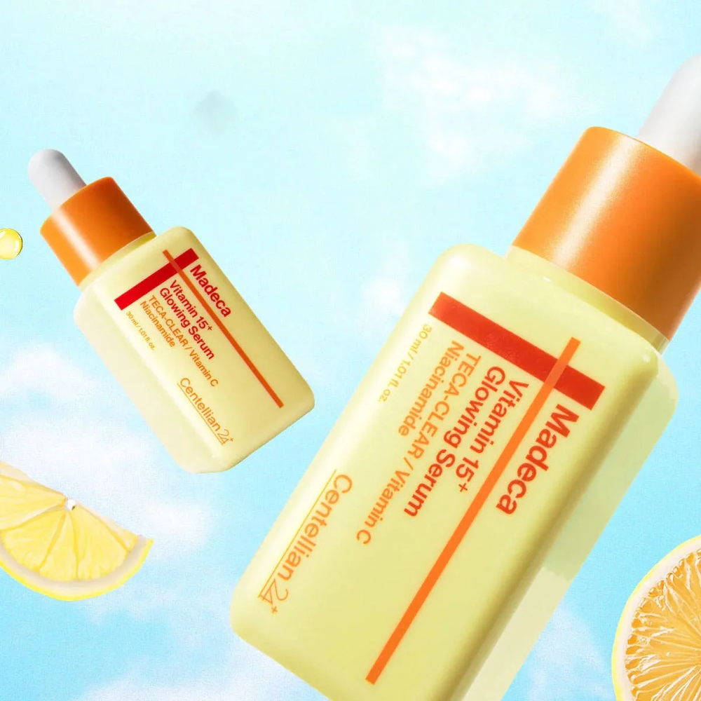 CENTELLIAN24 Madeca Vitamin 15 Glowing Serum bottles with lemon against blue sky